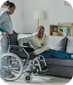 older man gets non medical home care in Philadelphia by Stay At Home Homecare specialist who is helping him to get on his wheelchair