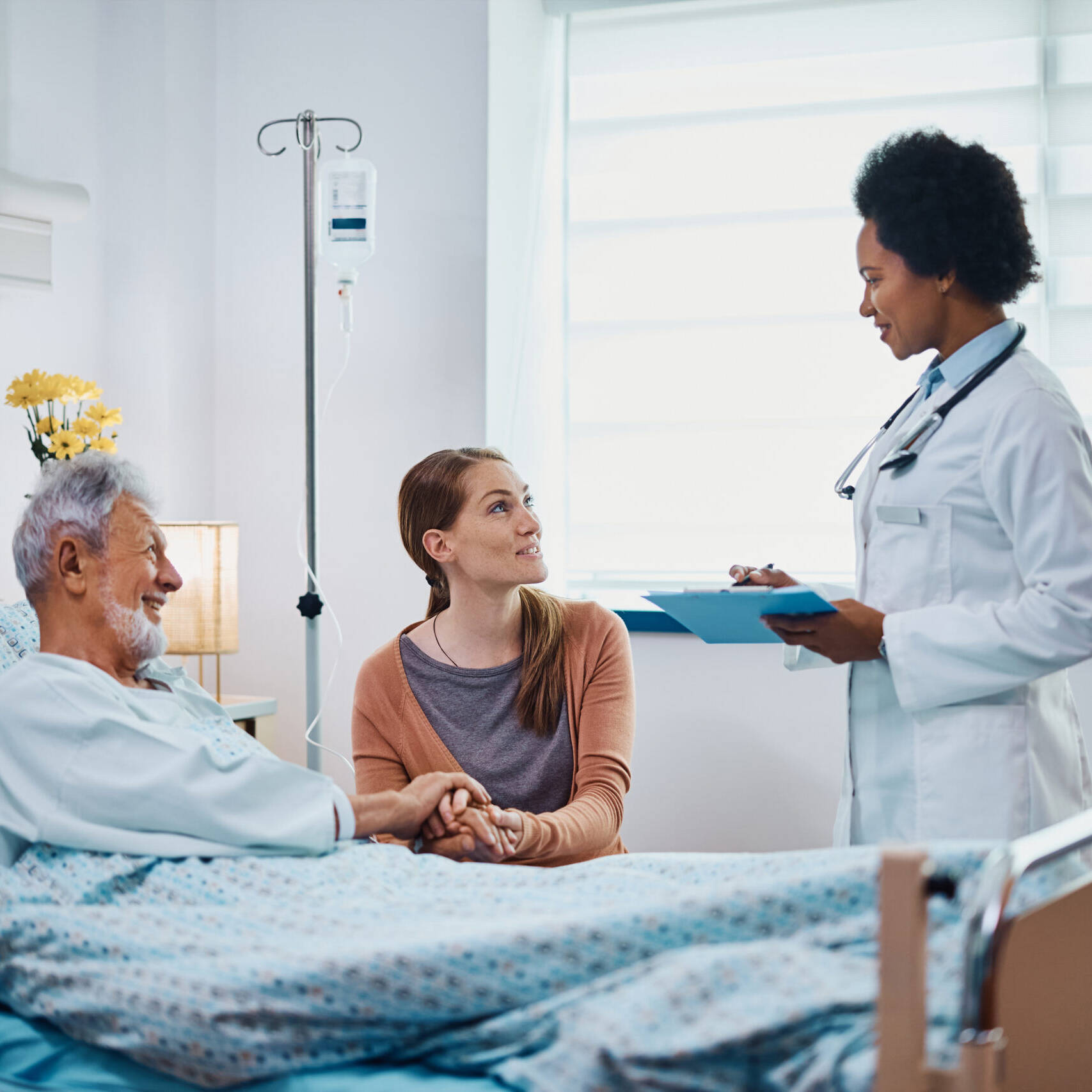 doctor, old man and his daughter in hospital