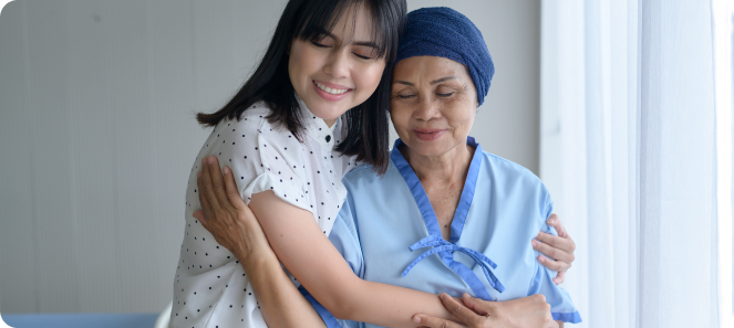 caregiver and senior lady hugging