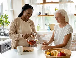 Caregiver and elderly woman preparing tea together in a kitchen.